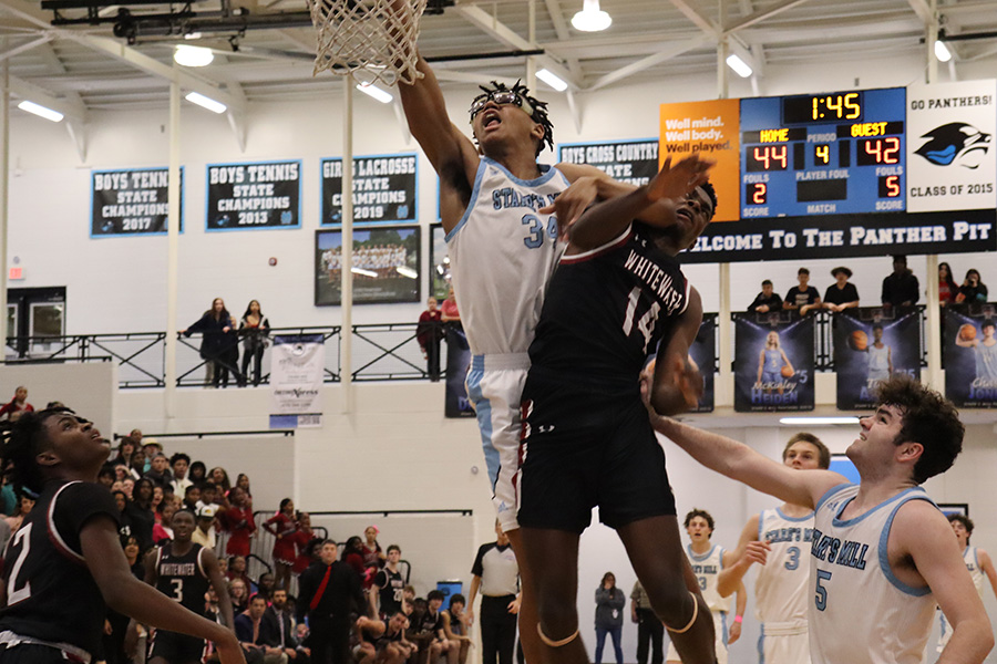 Sophomore starter William Robinson attempts a dunk in last Friday’s varsity basketball game against Whitewater. The win helped the Panthers secure the region’s fourth seed going into this week’s region tournament.