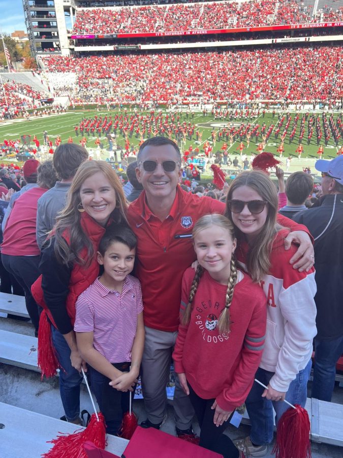 My second host and I at a Georgia game. I have been on the student exchange trip for more than six months. Throughout the experience, I will live with three different host families.