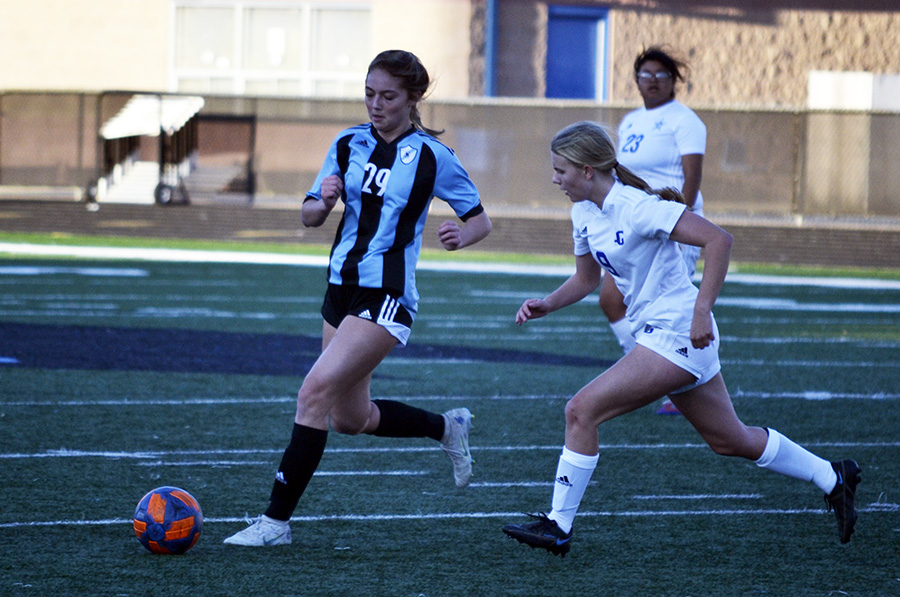 Sophomore Emily Daniel takes possession of the ball and attempts to move around her opponent. The Lady Panthers won the game 6-0, extending their winning streak to seven games.