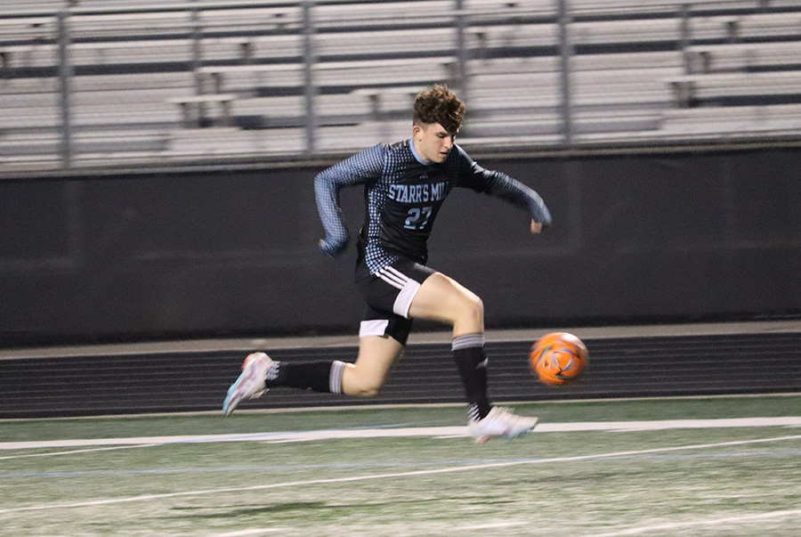 Sophomore Grant Ferron dribbles the ball down the field. Ferron contributed three goals in the 9-1 win over Fayette County. 