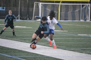 Sophomore Micah Seitz takes control of the ball. The Panthers defeated LaGrange after losing their previous two games.