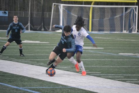 Sophomore Micah Seitz takes control of the ball. The Panthers defeated LaGrange after losing their previous two games.