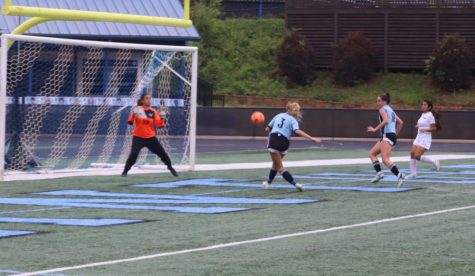 Sophomore Madi Cathcart attempts a goal against New Hampstead. The game ended in a mercy rule five minutes into the second half. After the 10-0 win, the Panthers will host the Spalding Jaguars on April 19 at 6 p.m.