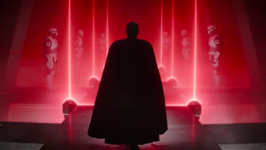 Moff Gideon walks down the long corridor of doors. On the side are altered Super Imperial troopers made of Beskar armor that are used later in the episode. 