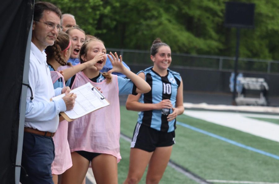Lady Panthers cheer while watching from the sidelines. Seven different players scored for Starr’s Mill as they dominated possession and the scoreboard.