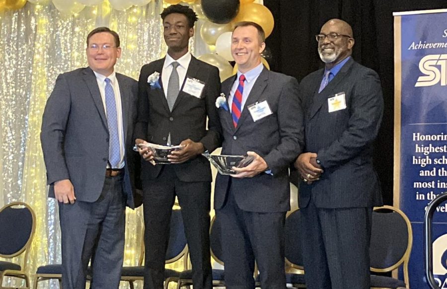 Senior Tito Alofe and math teacher J.B. Campbell pose for a photo after being named state STAR winners. The STAR program began in 1959. Alofe is the first state winner to hail from Fayette County.