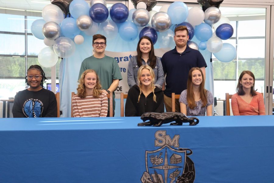 Eight signees pose at Georgia Future Educators signing day. The graduating seniors will go into an education-based profession and earn a degree in teaching. 