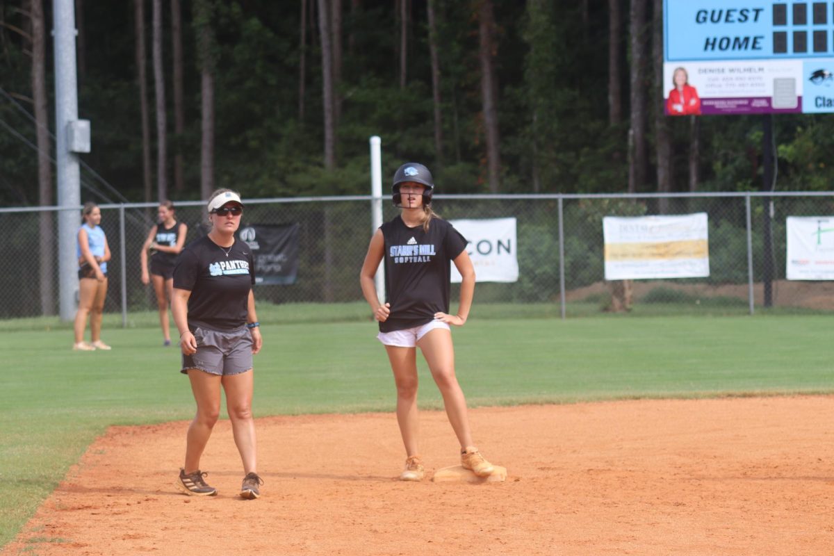 Head coach Peyton Dean instructs the team during practice. Dean and the Lady Panthers hope to capitalize on the experience gained from last season and return to the state playoffs after finishing fifth in the region last year.