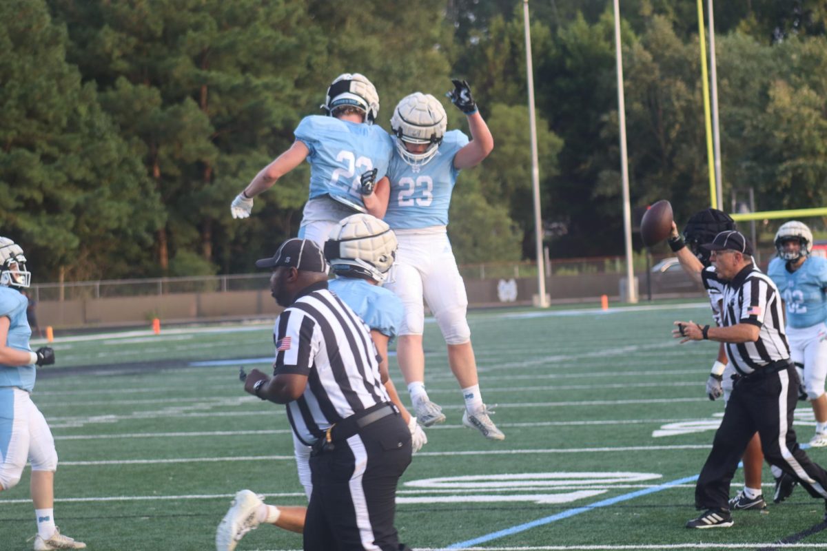 Senior Dorsey Benefield and junior Lincoln DeLaere celebrate after the Panthers scored a touchdown. The Panthers held a commanding lead with the starters but later put in the younger players, ultimately losing to Union Grove, 28-26. The regular season begins at 12:30 p.m. this Saturday as Starr’s Mill faces East Coweta in the Fayette-Coweta Kickoff Classic hosted at Newnan High School. 