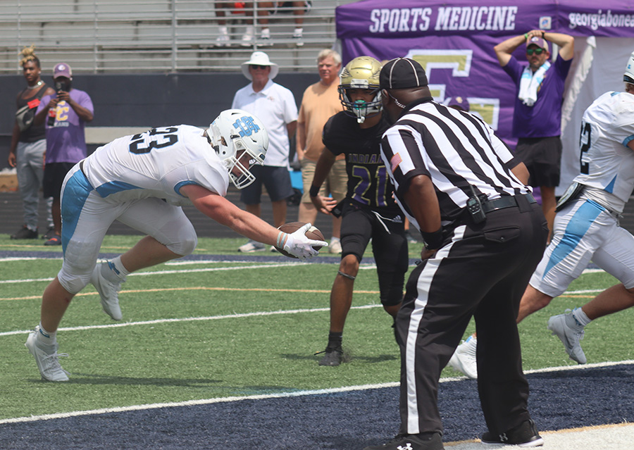 Senior Dorsey Benefield reaches for a touchdown. East Coweta defeated the Panthers 28-21 to begin the season.