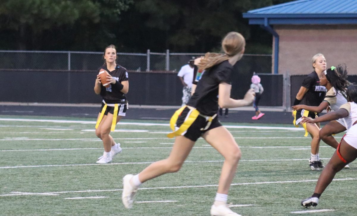 Junior Sydney Johnson lines up to make a pass. Even though the first quarter ended with the Panthers down, the offensive line continued to fight.