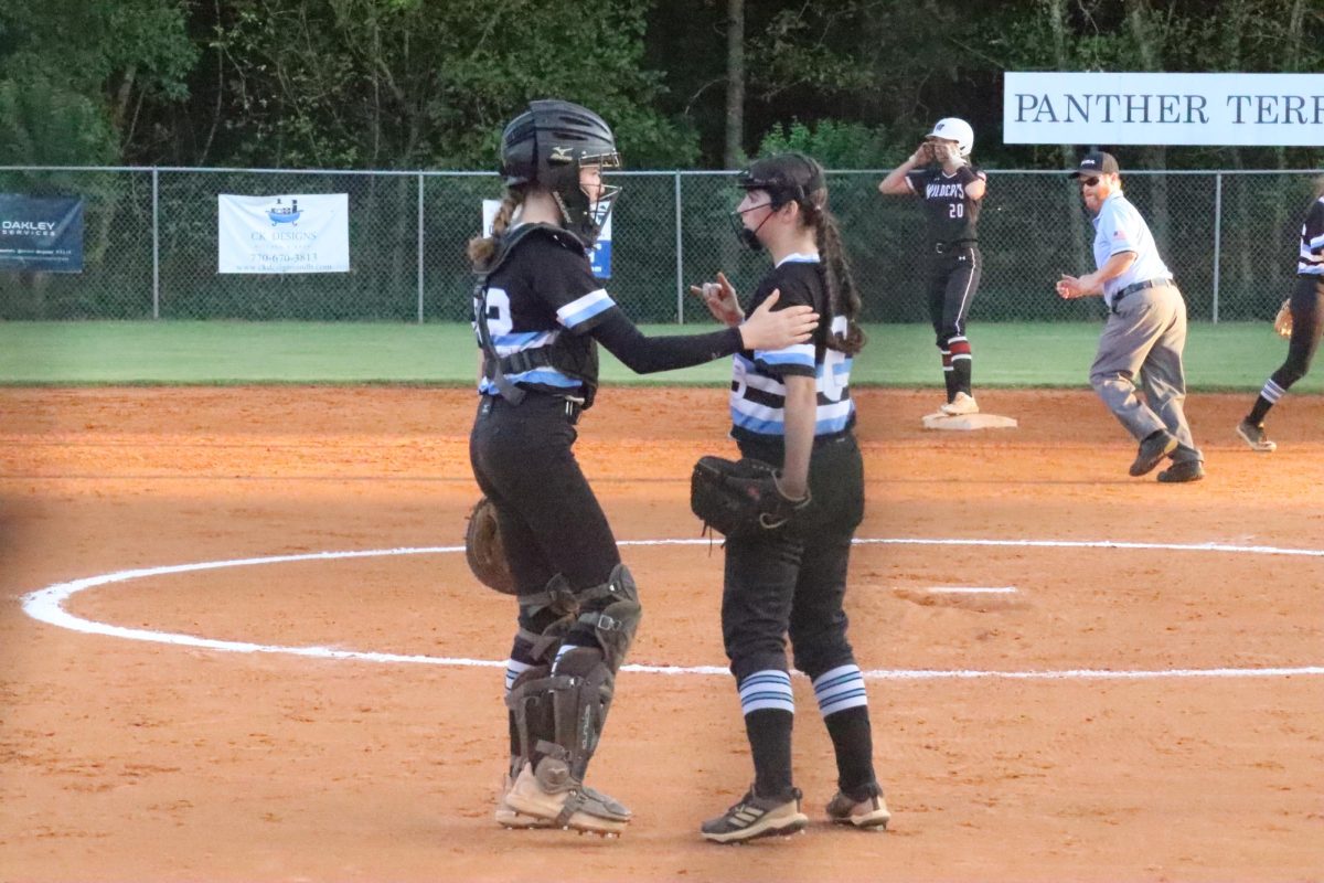Freshman catcher Olivia Irwin talks with sophomore pitcher Sophia Lombardo. Starr’s Mill held Teacher Appreciation Night between the junior varsity and varsity games as a way for the players to recognize their favorite teachers.