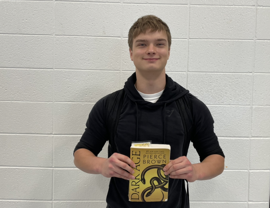Sophomore Elliott Dale is currently reading “Dark Ages” by Pierce Brown. “Dark Ages” is the fifth book in the science fiction series, “Red Rising.” The book is about a dystopian society where class is structured based on color. 