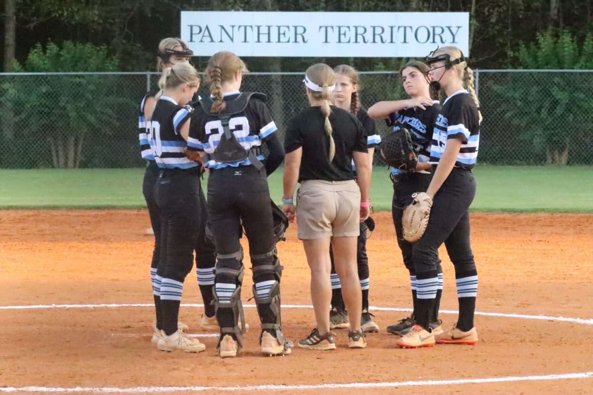 Head coach Peyton Dean talks to her young team to make pitching adjustments. Starr’s Mill finished their season missing the playoffs for the second year in a row.