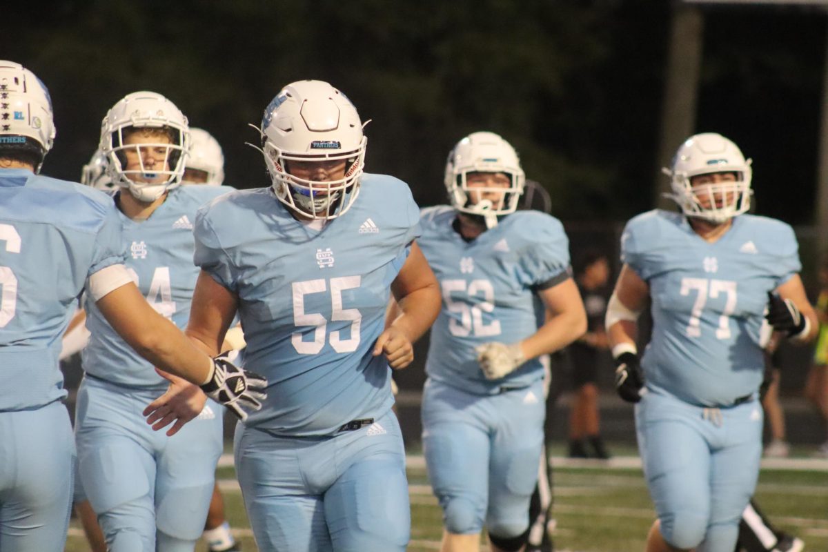 Field goal team runs off the field. Players include (from left to right) junior Trevor Gapp, senior Jacob Spitznagle, senior Zach Berger and sophomore Andrew Spitznagle. On Friday, the Panthers hosted the Trinity Lions in the annual Homecoming game, losing 17-10. Trinity now leads the region with a 3-0 record. 