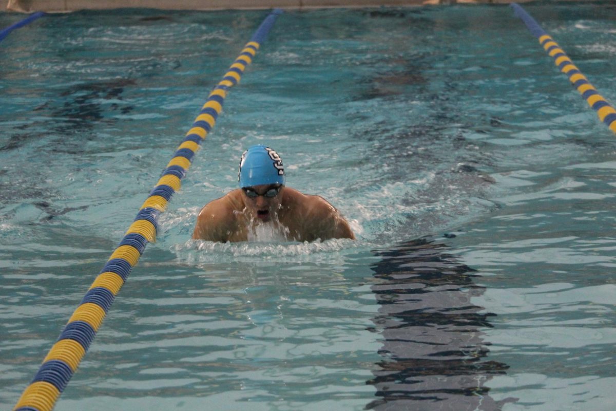 Junior Jeffrey Lin swims breaststroke down his lane. Despite the girls team defeating McIntosh, the boys team lost, and Starr’s Mill lost overall.