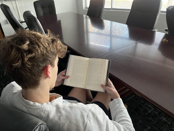Sophomore Henry Long reads “The Alchemist” by Paulo Coelho. Coelho has won 29 awards and has written 33 books. His most famous work, “The Alchemist,” has been sold internationally and published in over 80 languages.