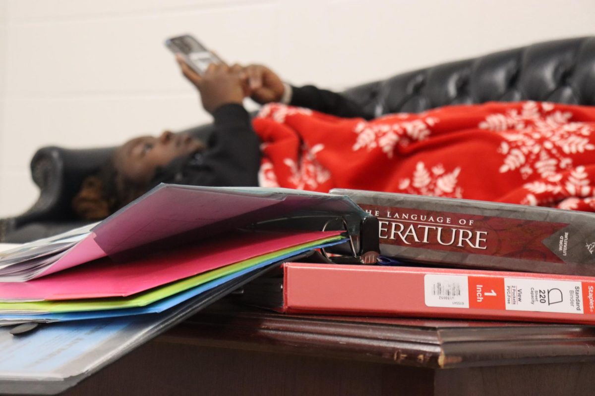 Senior relaxes on her phone while assignments pile up. Senior skip day has been a Starr’s Mill tradition, but recently it has gotten worse and some seniors skip every month instead of only once a year. This exceeds the five day unexcused absence limit and could result in unintended, harmful consequences. 