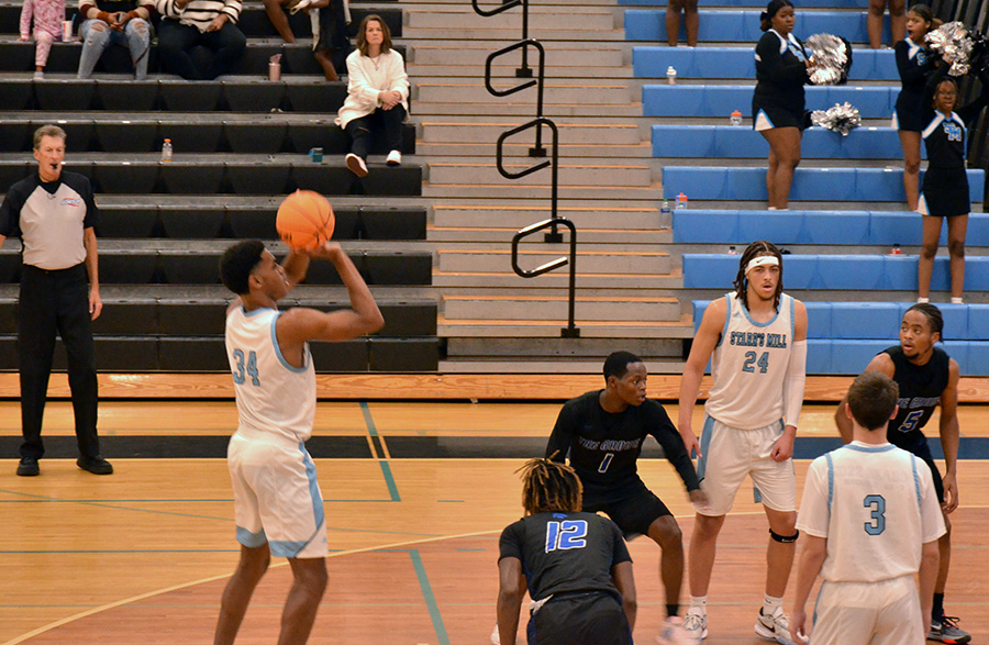 Junior William Robinson attempts a free throw. Following a slow first half, the Panthers defeated Locust Grove, 50-37.
