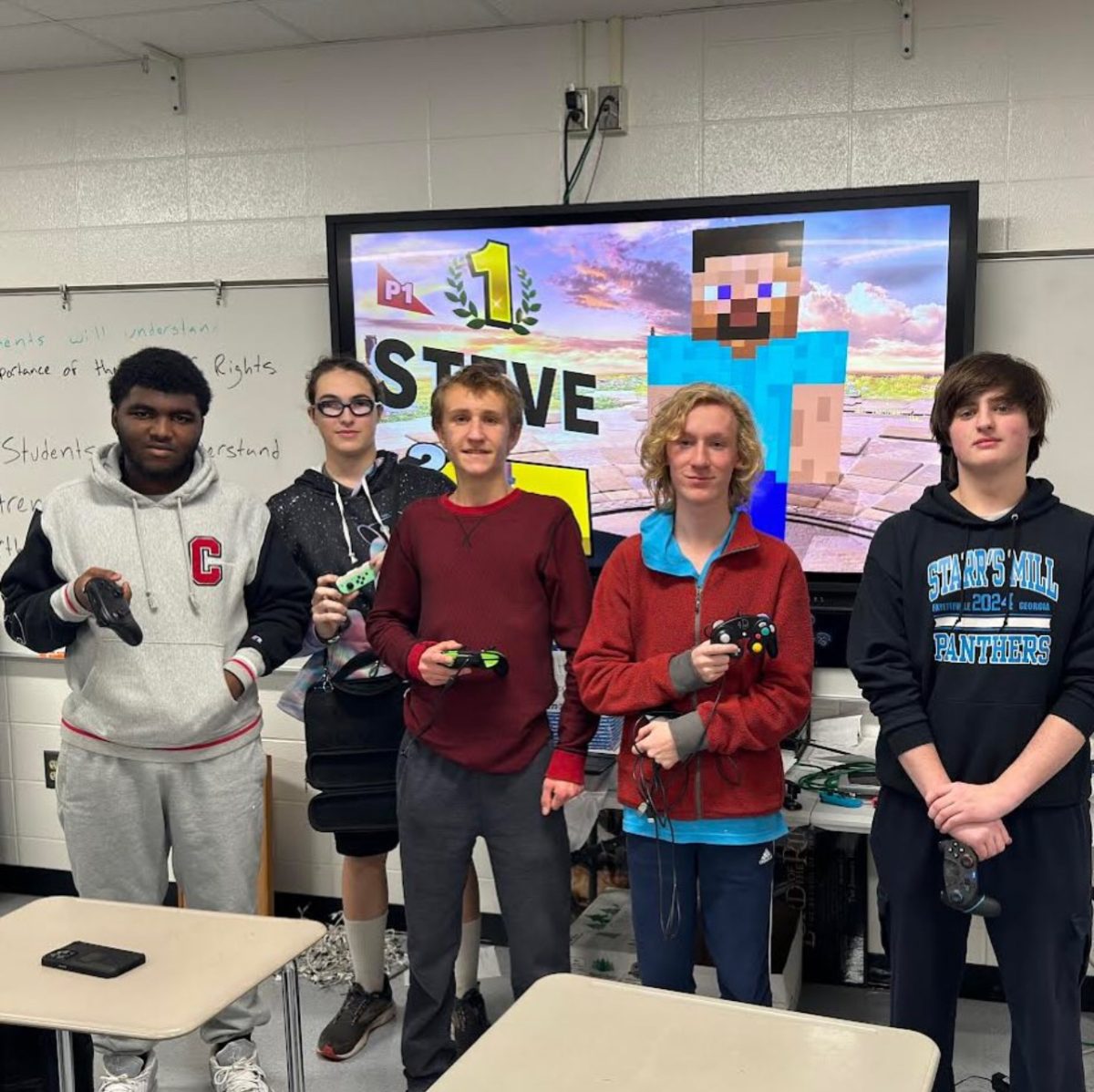 Members of the Starr’s Mill Esports team pose after advancing to the second round of playoffs. The team is able to practice at home and play their favorite games. This year’s team played Super Smash Bros. on the Nintendo Switch.