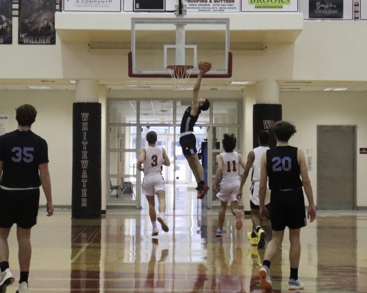 Junior Jory Williams dunks the ball during the team’s win against the Wildcats. The Panthers defeated Whitewater 43-35.