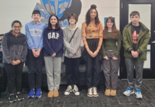 Winners of the Science Fair pose in the front office. The winners of their categories will compete in the regional competition in February.