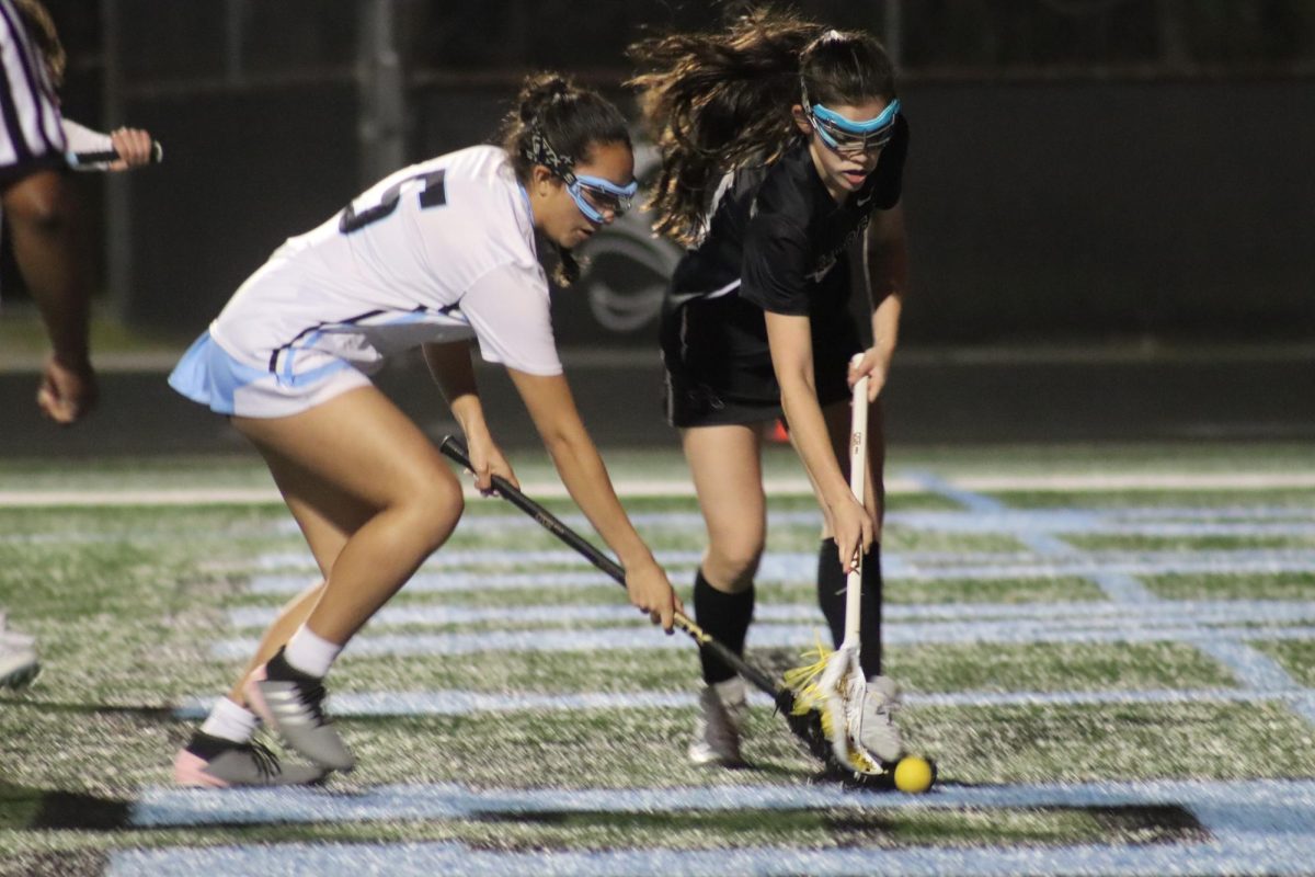 Sophomore Crista Alarcon-Suarez competes for the ball. The game was close, and although the Panthers fell short in the final score, they held their own against the Alpharetta Raiders in an aggressive game.