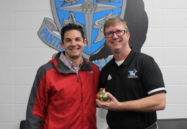 Assistant band director Bert Groover is March’s Golden Apple recipient. He was selected by February’s winner Laura Alldredge for being a good mentor for students inside and outside of the classroom.