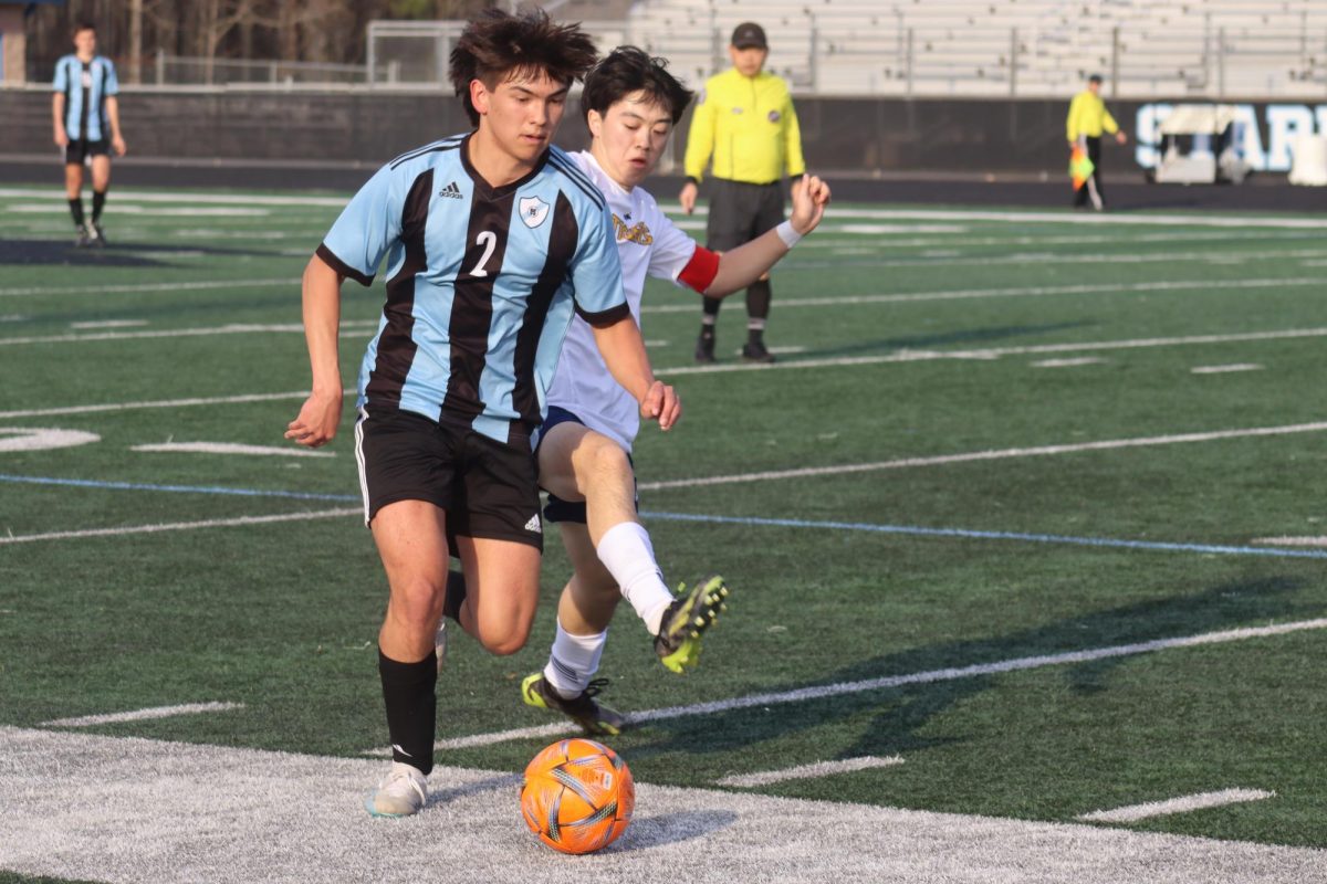 Junior Gavin Vu fights for possession against a Troup player. Starr’s Mill controlled the ball for a majority of the first half, but had to fight in the second half to regain momentum and secure the win, 4-1.