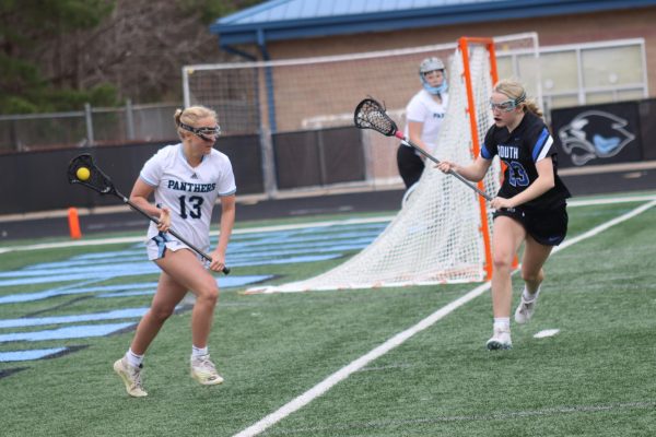 Senior Emma Frank works to move the ball up field. The Panthers fell to the War Eagles last Saturday, 20-6.