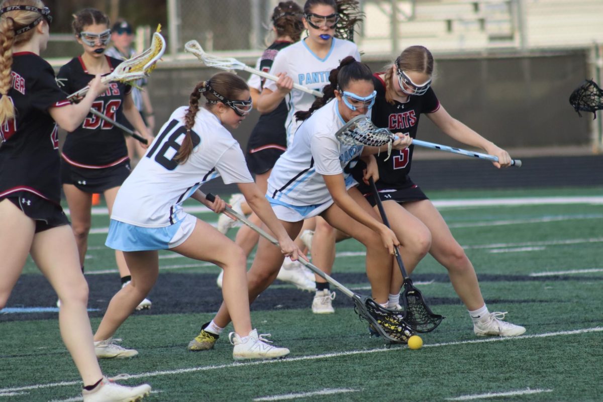 Sophomore Crista Alarcon-Suarez and freshman Diana Gonzalez battle for possession against a Whitewater player. Starr’s Mill dominated the field against the Lady Wildcats, winning 19-0.