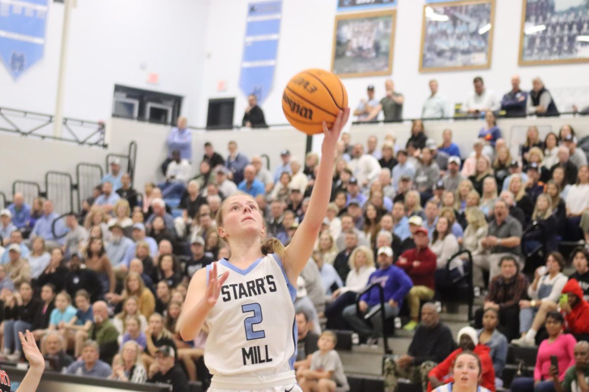 Senior Brooke Herdman attempts a lay up. Herdman scored a total of five points in her final game for the Lady Panthers.