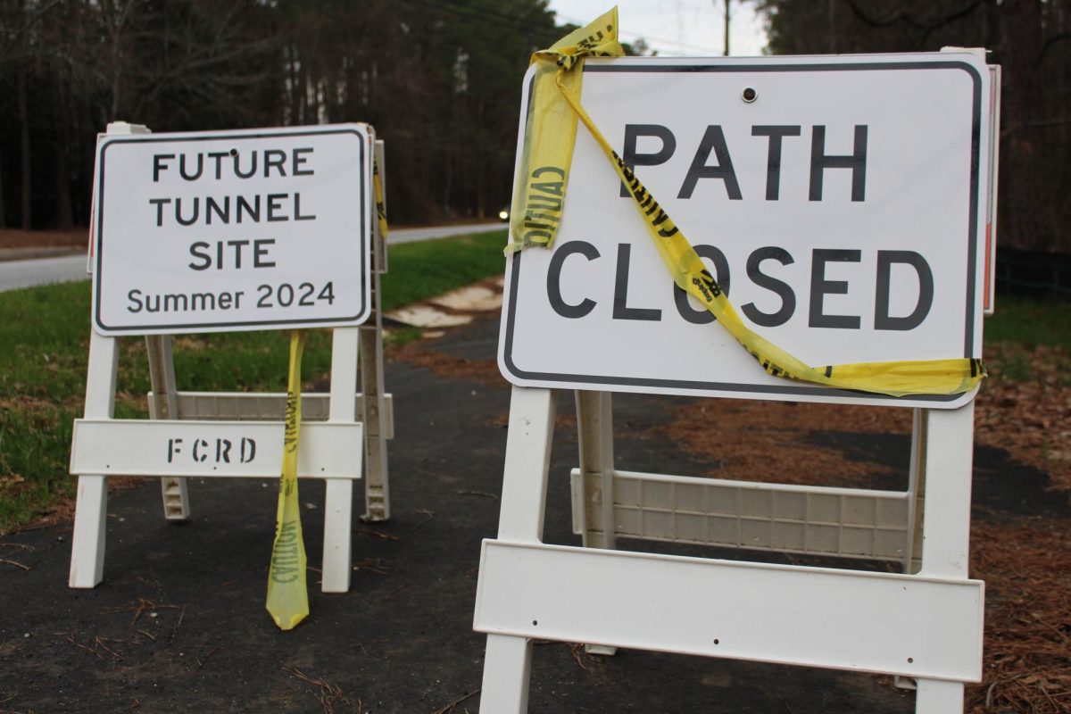 Signs announcing the beginning of construction on the Redwine tunnel. Construction will begin this summer. No completion date has been announced.