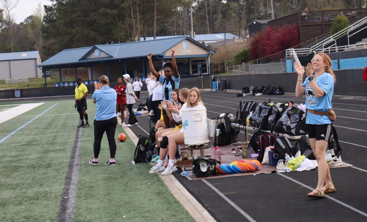 Lady Panthers celebrate the team’s performance late in the first half. The half ended 2-1 with the Panthers in the lead.