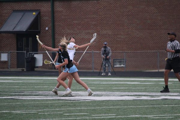 Sophomore Anna McFaddin catches the ball after the draw in the first half of the game. After a strong second quarter, Starr’s Mill defeated McIntosh, 10-7.