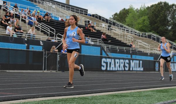 Sophomore Antonella Diaz rounds her last lap during the 1600 meter race. She ran the mile in 6 minutes, 53 seconds and finished 15th. 