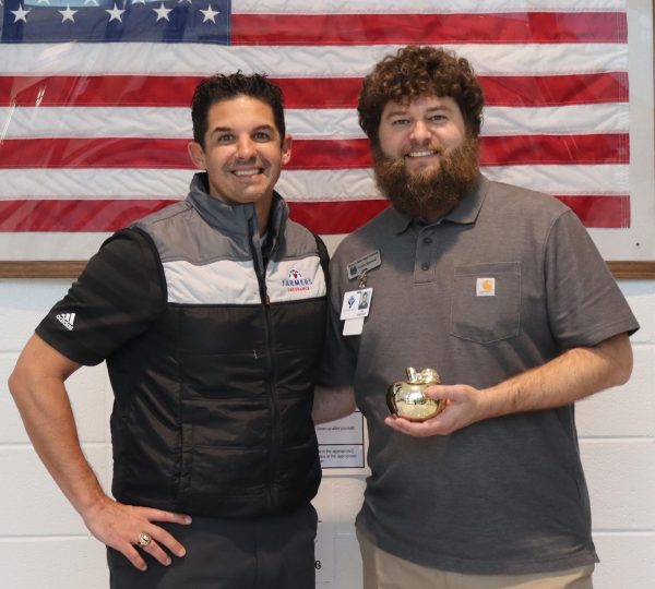 English teacher and newspaper adviser Justin Spencer has been named April’s Golden Apple recipient. He was selected by March’s recipient Bert Groover for caring about and inspiring his students. 