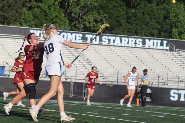 Freshman Anna Moran passes the ball down the field. The Lady Panthers dominated the field, winning 21-3.