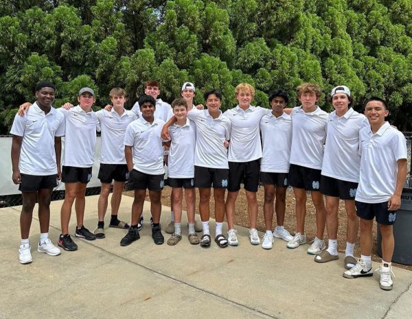 Boys tennis team poses after falling to Pace in the elite eight round. The boys and girls both had great seasons, but both got knocked out in the state quarterfinals.