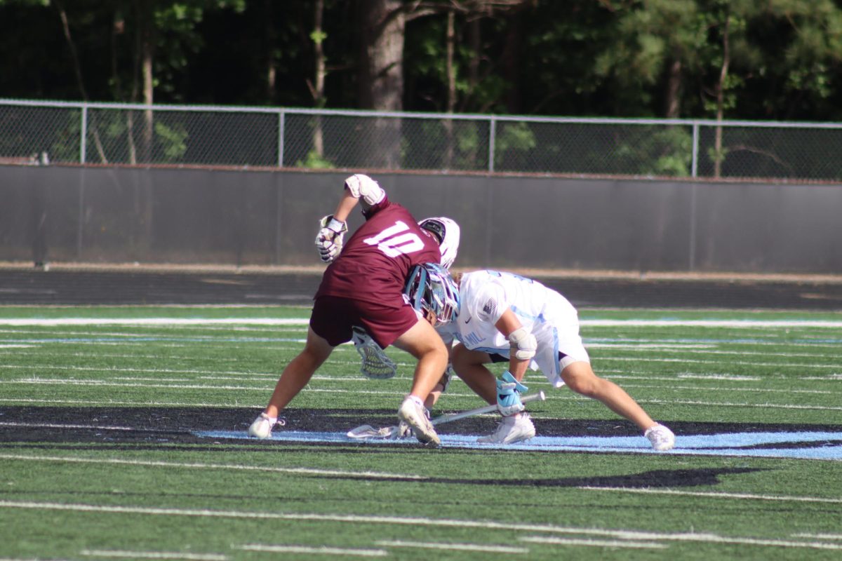 Junior Caleb Brown (#10) goes head-to-head with Cadet for possession of the ball. The Panthers had possession of the ball throughout most of the match, holding a strong lead for the majority of the game. 