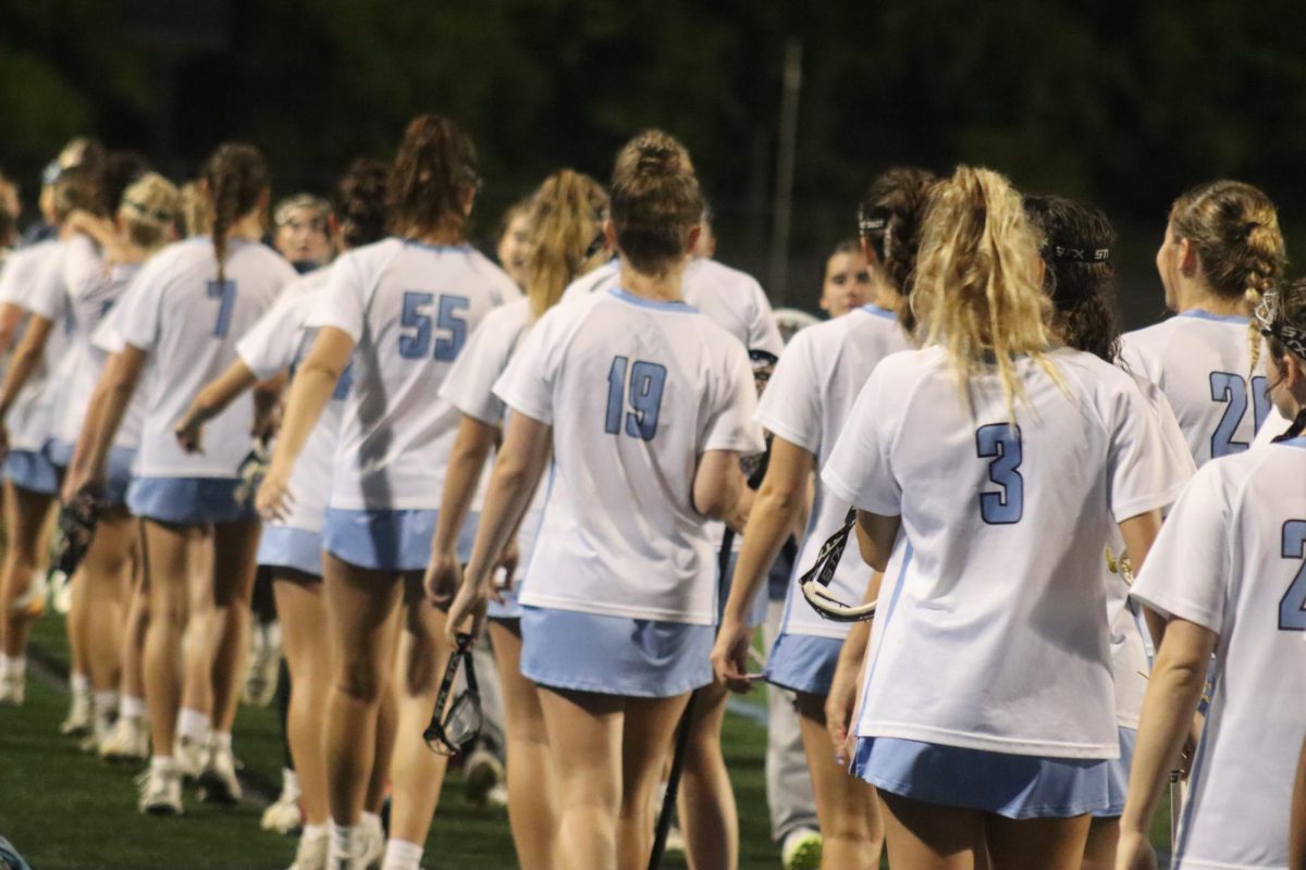 Varsity girls lacrosse team bumps sticks with the Pace Academy Knights after their game. The Lady Panthers defeated the Knights, 19-9.