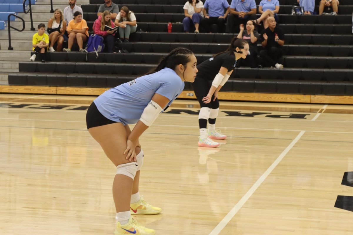Junior Annamarie Torqueza gets ready for a play. She was one of the players who made a major comeback toward the end. Despite the Panthers having a shaky start in the first three sets, Starr’s Mill came back to defeat the Trojans, 3-2.