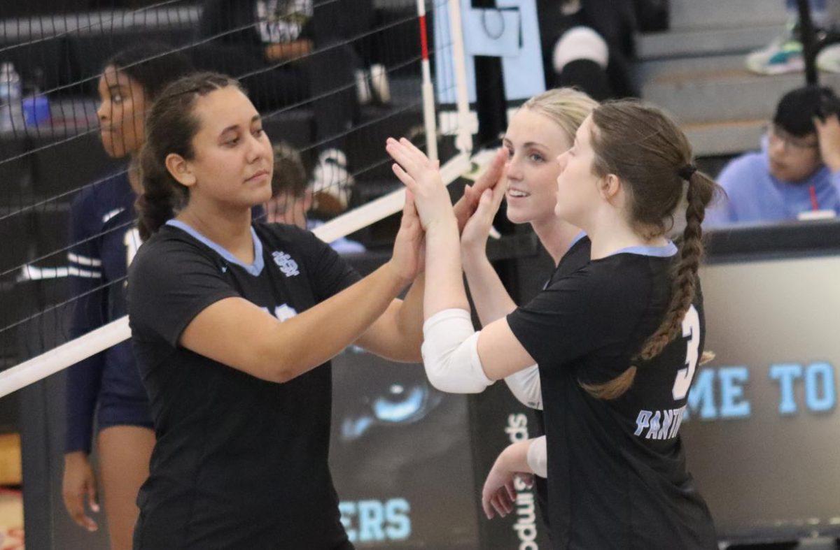 Panther volleyball celebrates after earning a point. Starr’s Mill placed second in the VolleyBrawl with Woodward Academy winning the tournament overall.