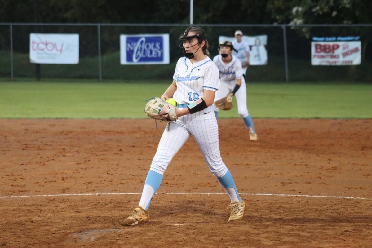 Sophomore Emma Garcia gets ready to throw a pitch with junior Kayla Peavyhouse defending behind at third base. The Starr’s Mill Panthers defeated the Griffin Bears in only four innings, 12-0.
