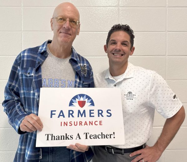 AP Macroeconomics teacher Mark DeCourcy is the September recipient of the Golden Apple award. He was selected by AP Physics teacher Nicholas Gillies for his engagement of student interest and the way he connects his curriculum to current events. 