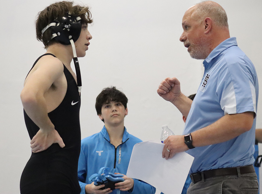 Head coach John Steiner works with one of the wrestlers between matches. Starr’s Mill hosted a quad meet to help the wrestlers prepare for area traditionals on January 30.