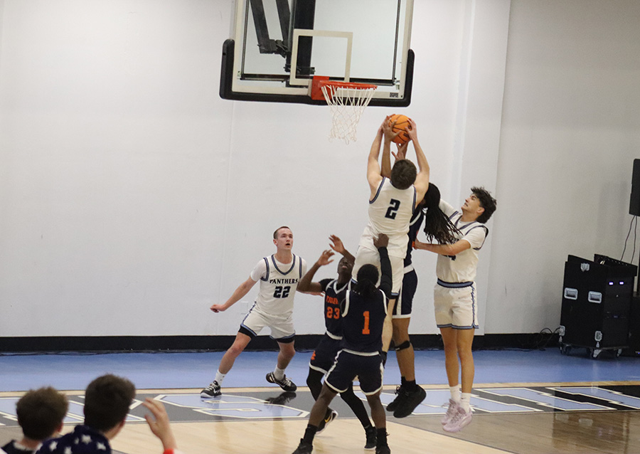 Junior Scott Moreman attempts a basket while surrounded by Mundy’s Mill players. In a close senior night-game last night, the Panthers finished the regular season with a 62-61 loss. The team will now focus on the region tournament played at Harris County.