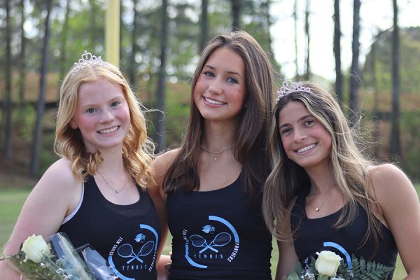 Seniors Alexa Walters (left) and Chloe Bearden (right), along with junior Reese Callahan (middle), smile during senior night celebrations. Starr’s Mill tennis honored 11 seniors prior to hosting East Coweta High School on April 2.